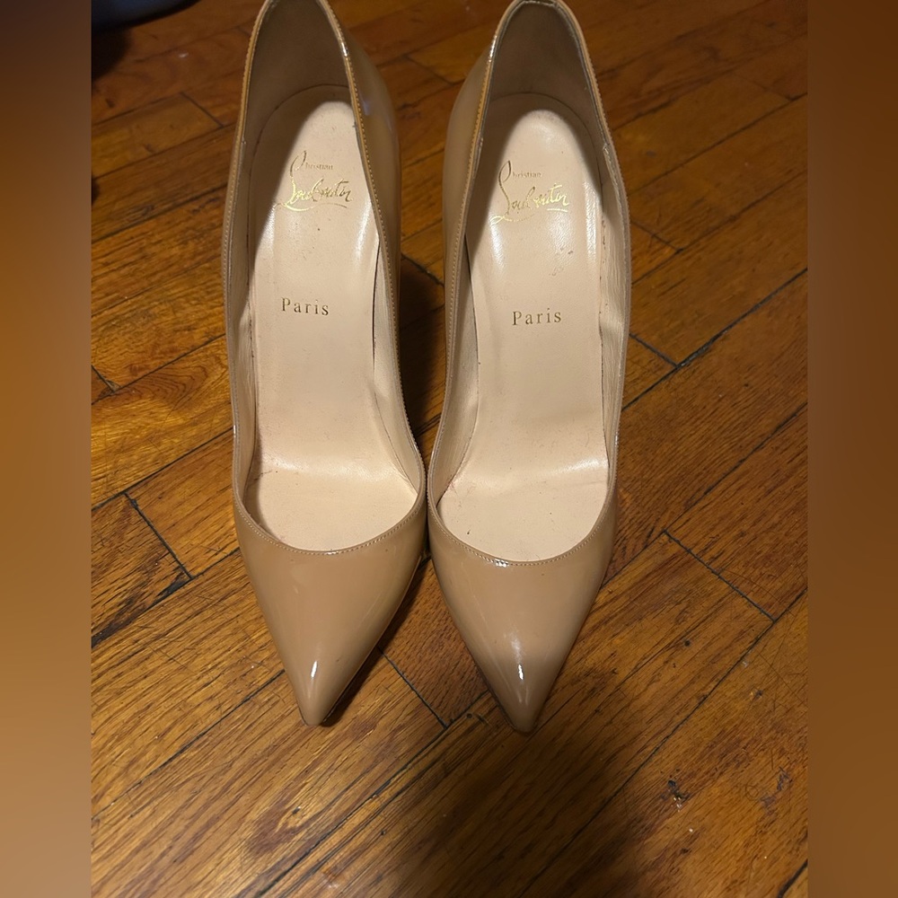 Worn Christian Loubutins. The Red bottoms can be fixed.